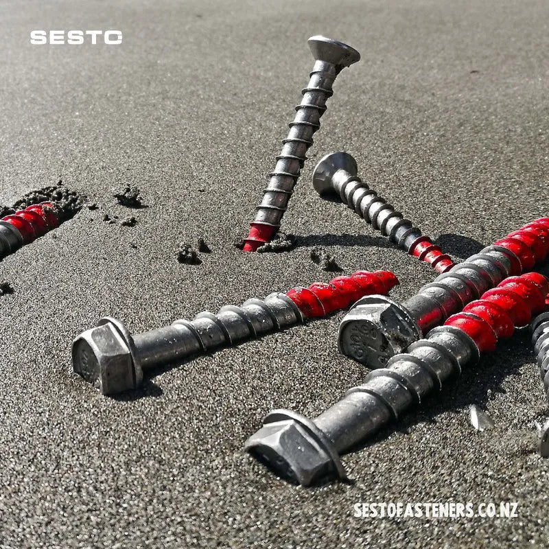 Sesto Screwbolt promo image with Hex head bolts arranged on beach sand.