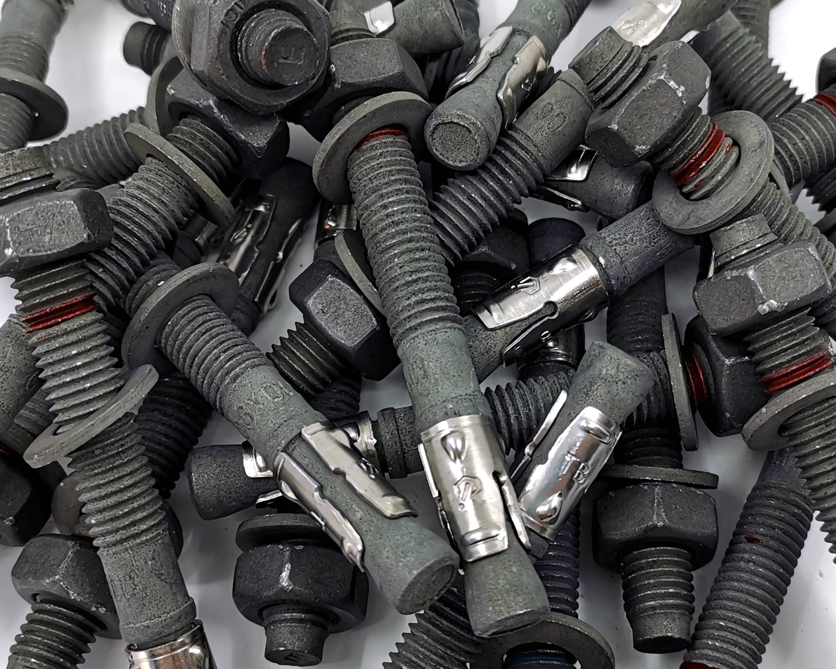 ICCONS Sheradised Through Bolts arranged in a pile.