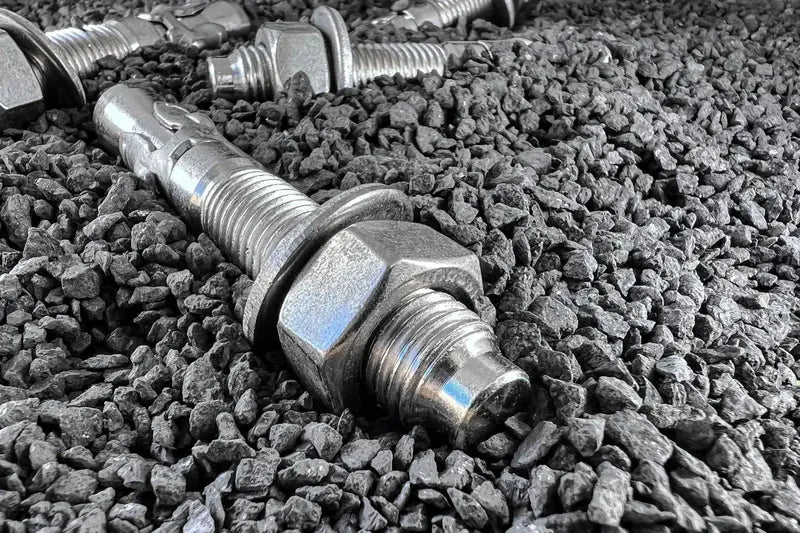 ICCONS Stainless Steel concrete bolts resting on stone chips.screed.